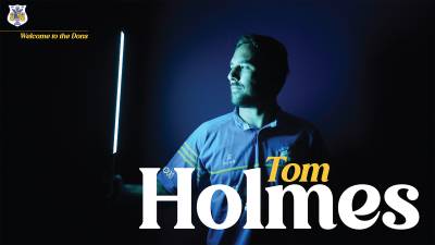 Dons sign full back Tom Holmes on two-year deal